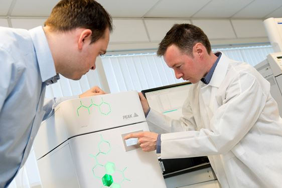 Two lab workers using the Precision hydrogen gas generator